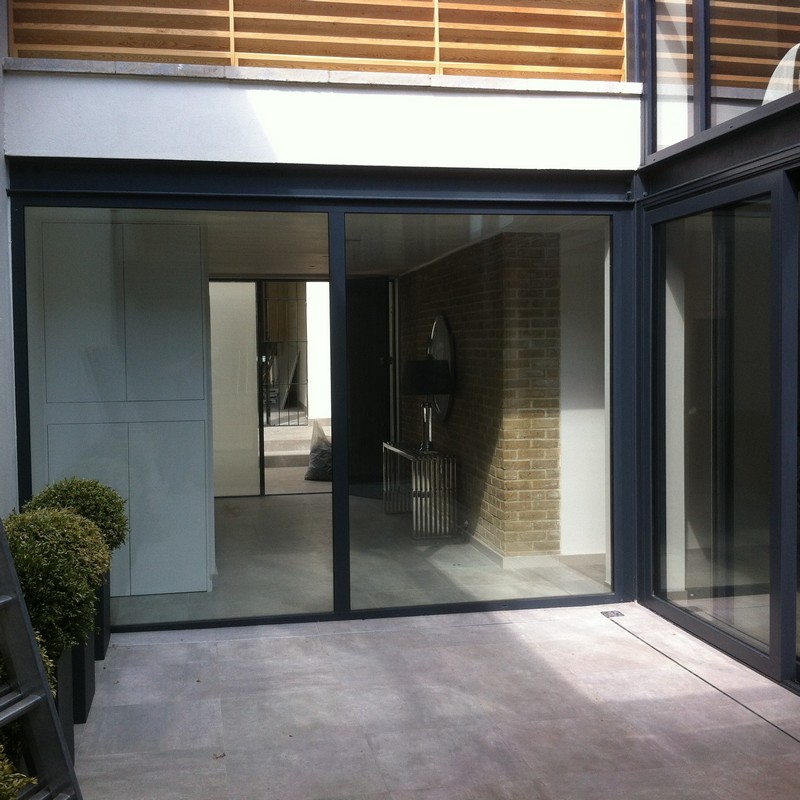 Floor-to-ceiling sliding doors opening to courtyard in Shoreditch
