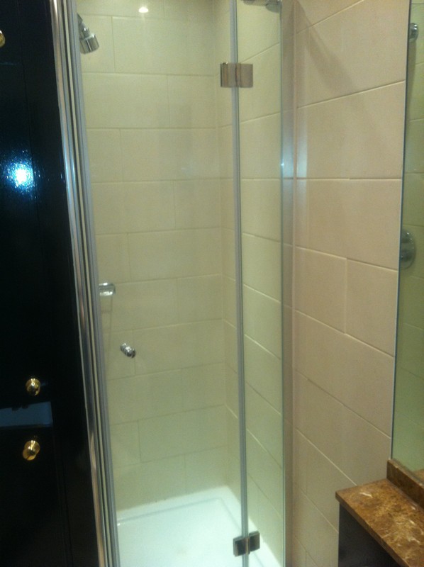 Frameless glass shower enclosure with chrome fittings in Shoreditch