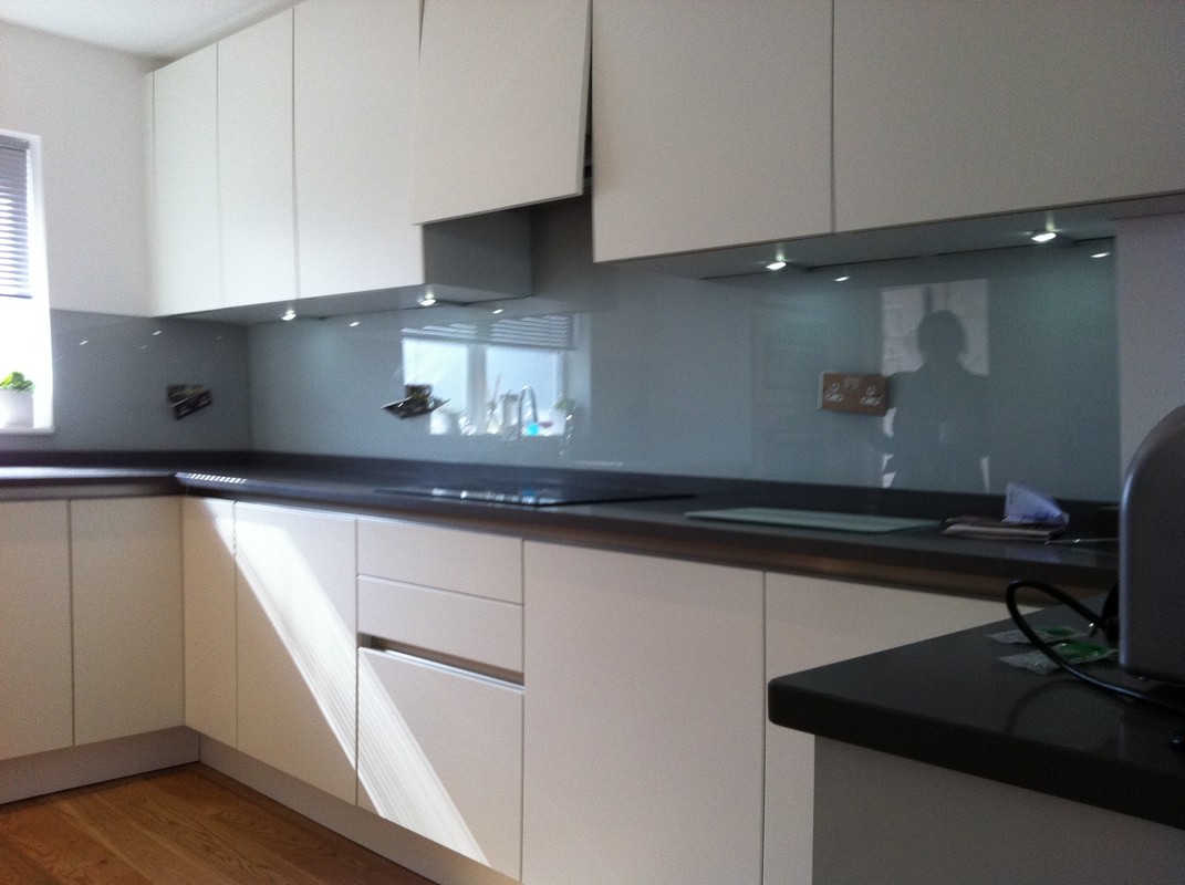 Grey glass kitchen splashback with LED lighting in Shoreditch