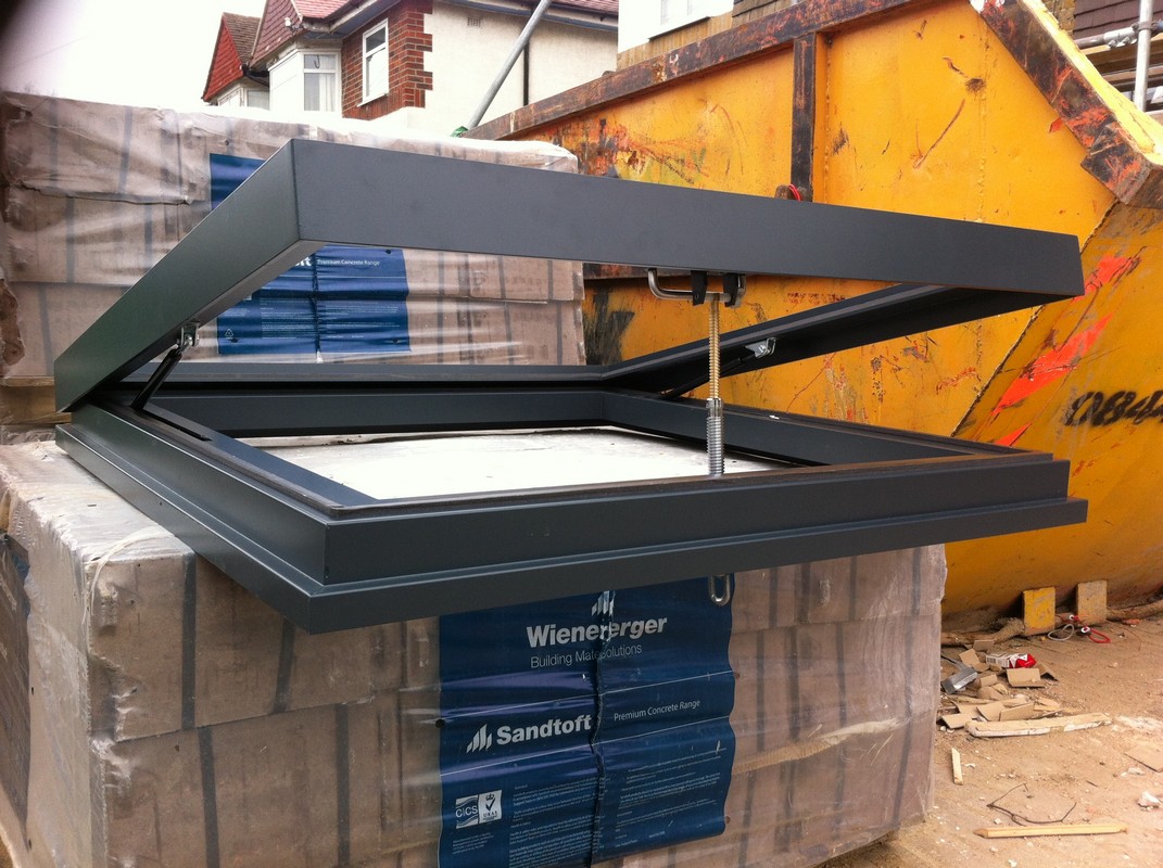 Opening flat roof skylight in anthracite grey installed in Shoreditch